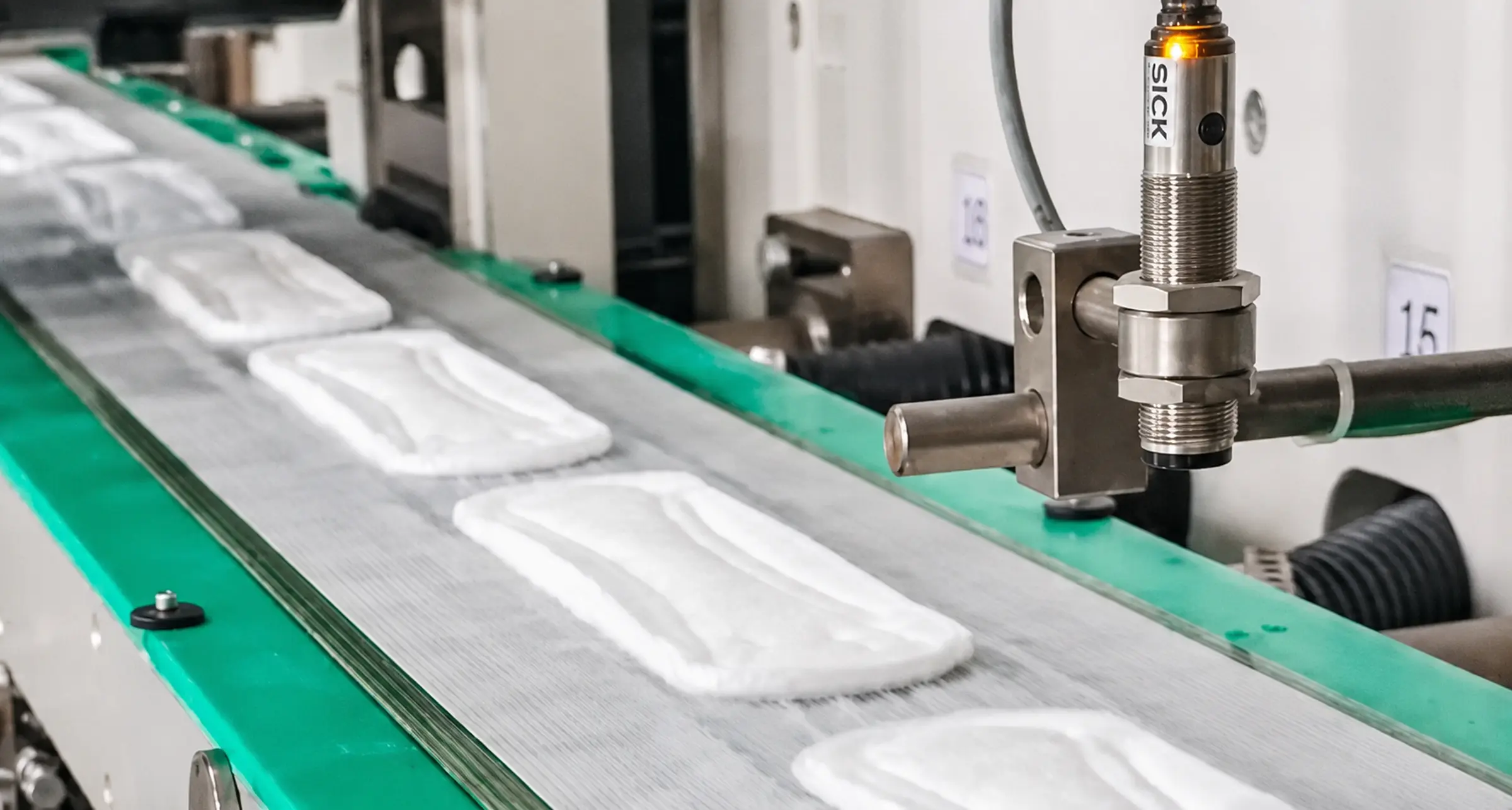Sanitary pads moving through a production line